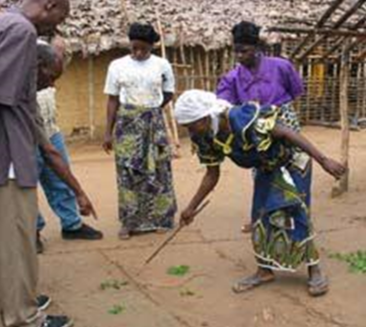 Local communities engaging in resource mapping using satellite images (above) and planning on the ground (below) in Munguli community,Mkalama District, Tanzania. (Credit: NLUPC)
